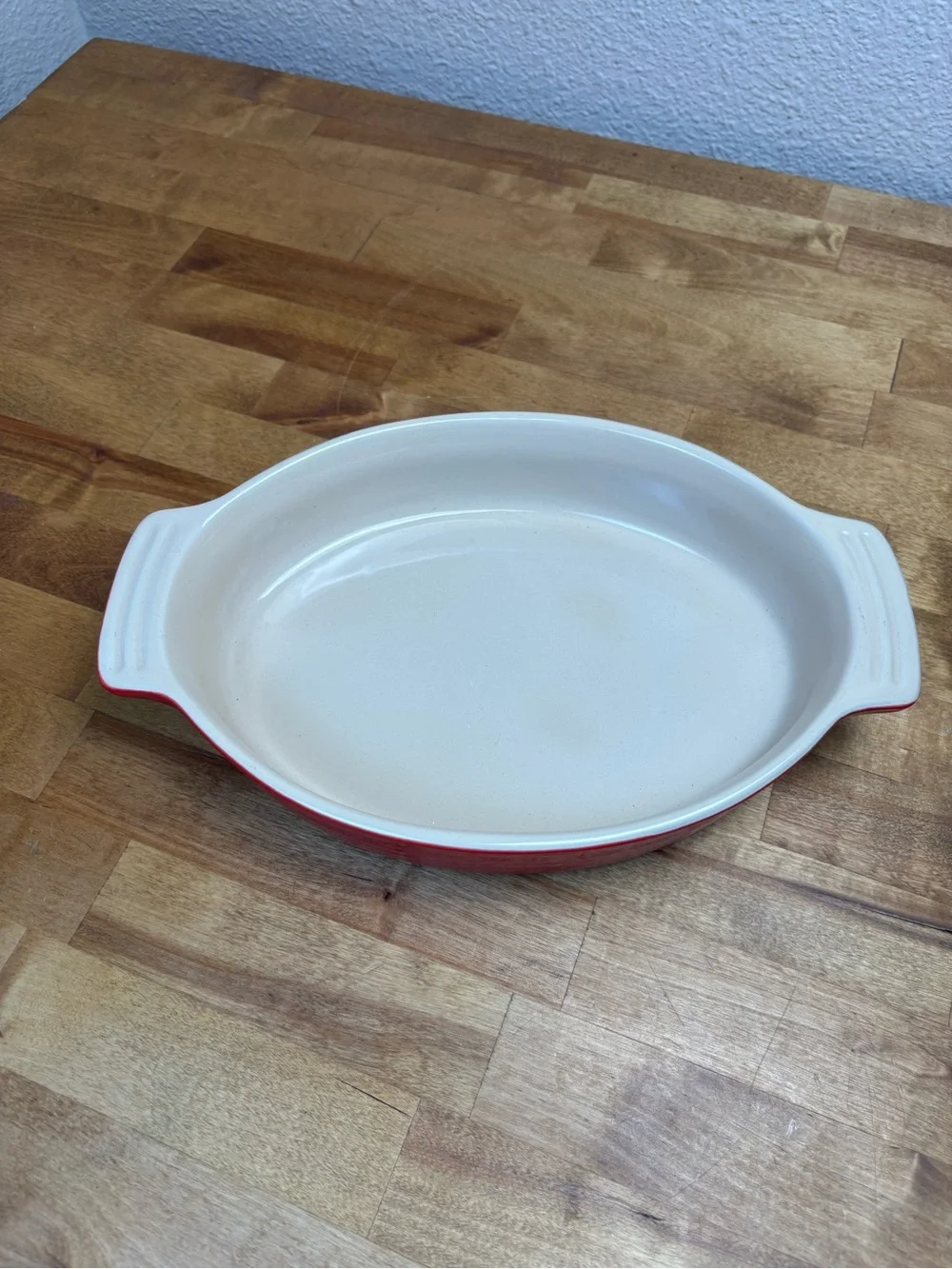 Le Creuset Red and Cream Oval Ceramic Baking Dish